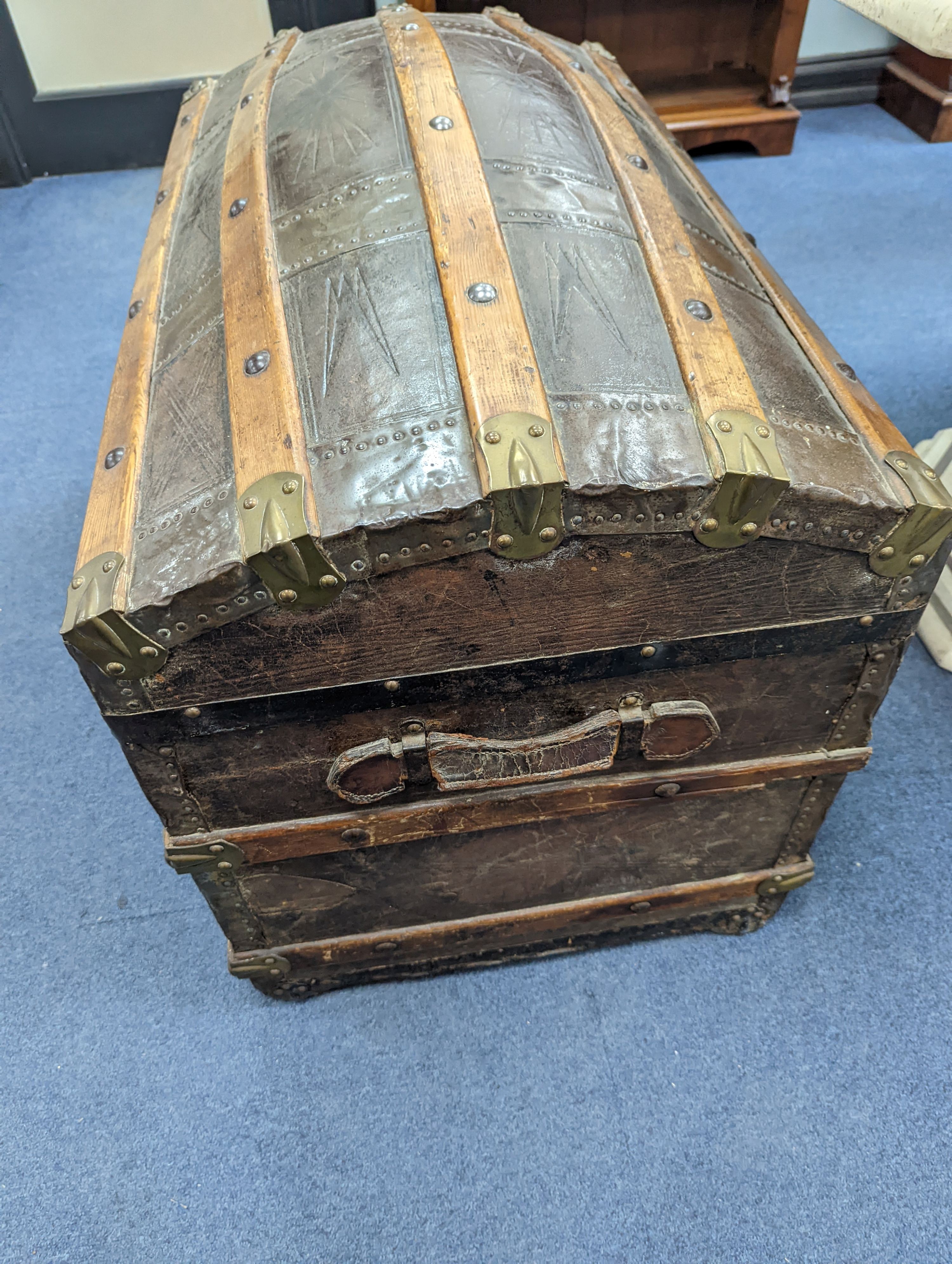 A Victorian leather bound dome top trunk, length 88cm, depth 50cm, height 60cm